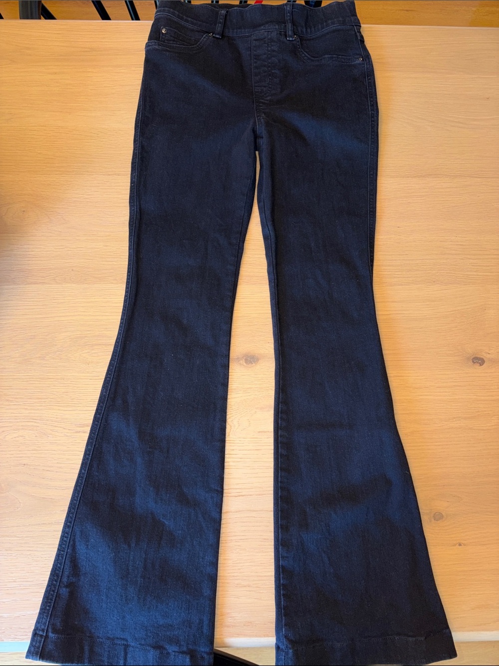 SPANX High-Rise Pull-On Flare Jeans in Black - Picture 3 of 8
